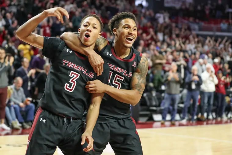 Temple players Josh Pierre-Louis (3) and Nate Pierre-Louis celebrate at the buzzer after an overtime win against SMU at the Liacouras Center in Philadelphia on Saturday, Feb. 08, 2020. Temple won, 97-90, despite trailing by double-digits in the first half of the game.