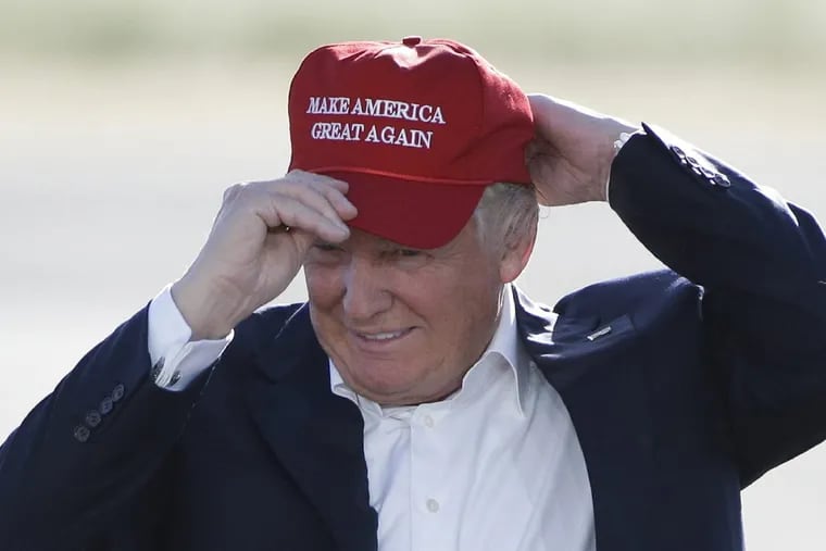 In this AP file photo, President Trump is seen wearing a “Make America Great Again” hat.