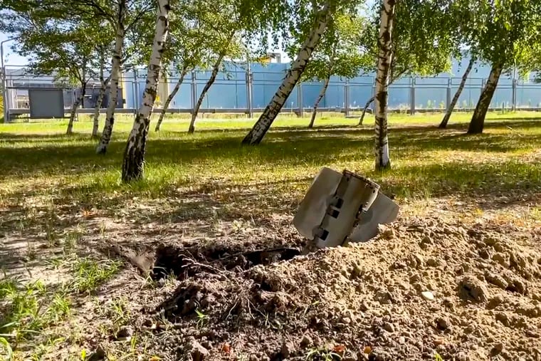 In this photo taken from video and released by Russian Defense Ministry Press Service on Sunday, a rocket fragment after shelling is seen near the Zaporizhzhia Nuclear Power Station in territory under Russian military control, southeastern Ukraine.