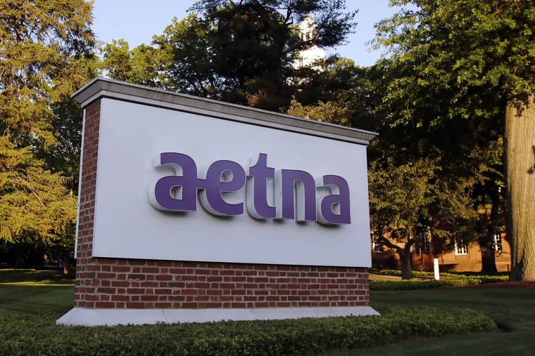 FILE photo shows a sign on the campus of the Aetna headquarters in Hartford, Conn.