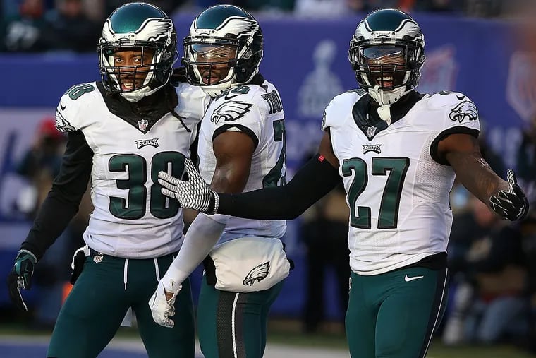 Malcolm Jenkins (right) is absent for the start of organized team activities.