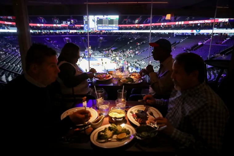 People dining at Stephen Starr's Adrian restaurant, which has a view of the court, before a Sixers game at the Wells Fargo Center in Philadelphia.