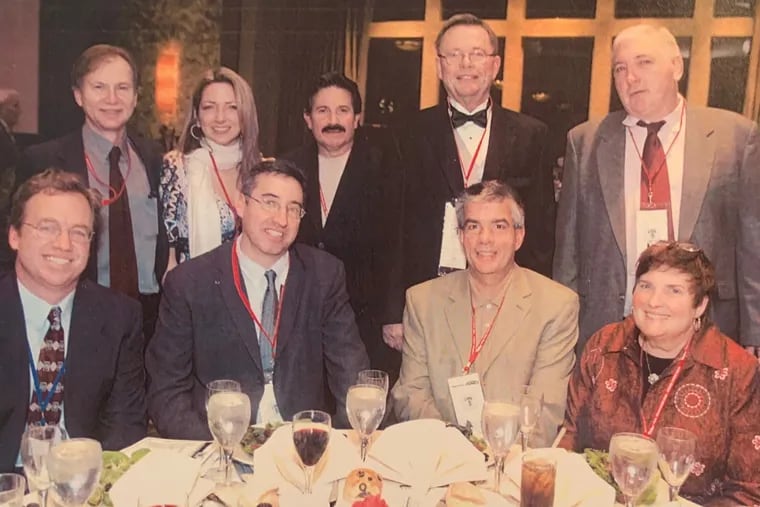 Frank Fitzpatrick (second from right, front) is surrounded by his colleagues from The Inquirer in 2007.