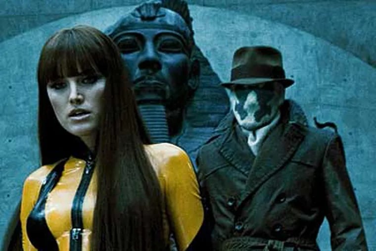 Malin Akerman, left, as Silk Spectre II and Jackie Earle Haley as Rorschach in Warner Bros. Pictures' and Legendary Pictures' action adventure "Watchmen."