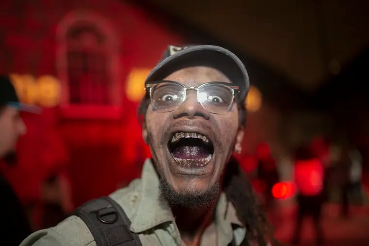 Mohamed Hassan, a member of The Swat team acting a choreographed dance at Eastern State Penitentiary as part of Terror Behind the Walls, which has been canceled this year due to coronavirus.