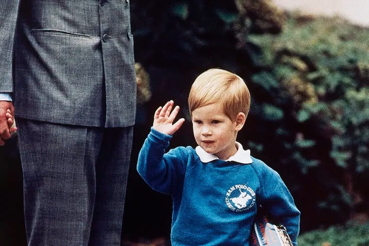 In this Sept. 16, 1987 file photo, Britain's Prince Harry waves to photographers on his first day at a kindergarten in Notting Hill, West London.  Princess Diana’s little boy, the devil-may-care prince with the charming smile, has become a father. But preschool can raise issues even for the wealthy and powerful.  (AP Photo/Martin Cleaver, File)