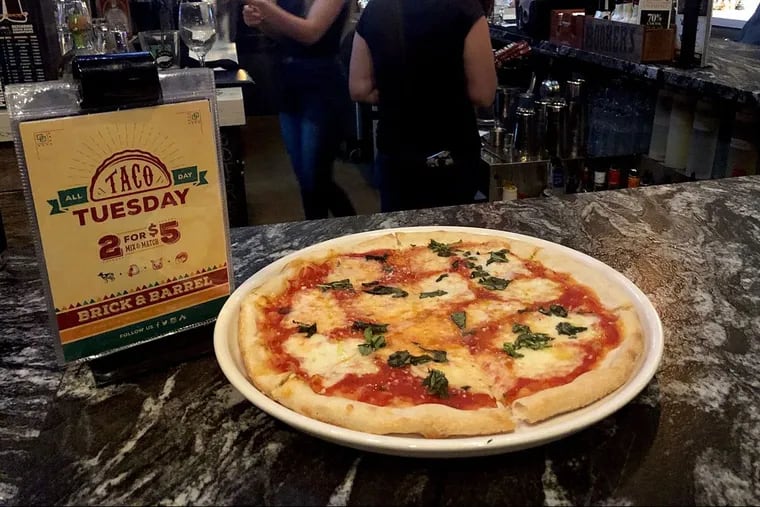 The $5 happy-hour pizza at Brick & Barrel in Maple Glen.