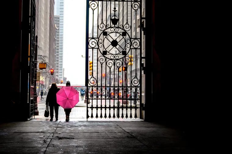 March 7, 2022: A wet day on South Broad Street. The aluminum and stainless steel gates were installed in 2015 at all four City Hall portals, based on preliminary sketches - never completed - by architect John McArthur Jr. as he designed City Hall 150 years ago. They replaced the chain-link fencing that had been around since the 1980s when restoration began on City Hall Tower.
