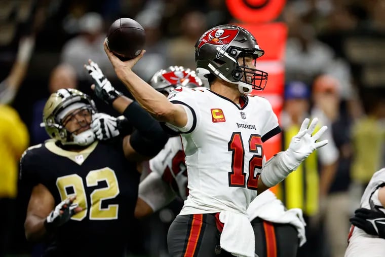 Tampa Bay Buccaneers quarterback Tom Brady throws a pass while being pressured by Saints defensive end Marcus Davenport (left) during a Week 2 clash in New Orleans. The Bucs and Saints meet again Monday night in Tampa. (Photo by Chris Graythen/Getty Images)