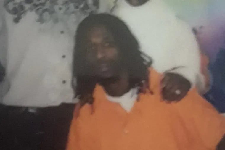 Hassan Bennett, in a family photo taken in prison, represented himself in his retrial for the murder of Devon English and the shooting of Corey Ford.