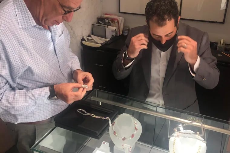 Steve Hersh (left) and his son-in-law Brett Sandler at their Milner Diamonds retail store on Jewelers Row. The duo relaunched a cash-for-gold business in June, called We Buy Gold, to meet demand during the pandemic.