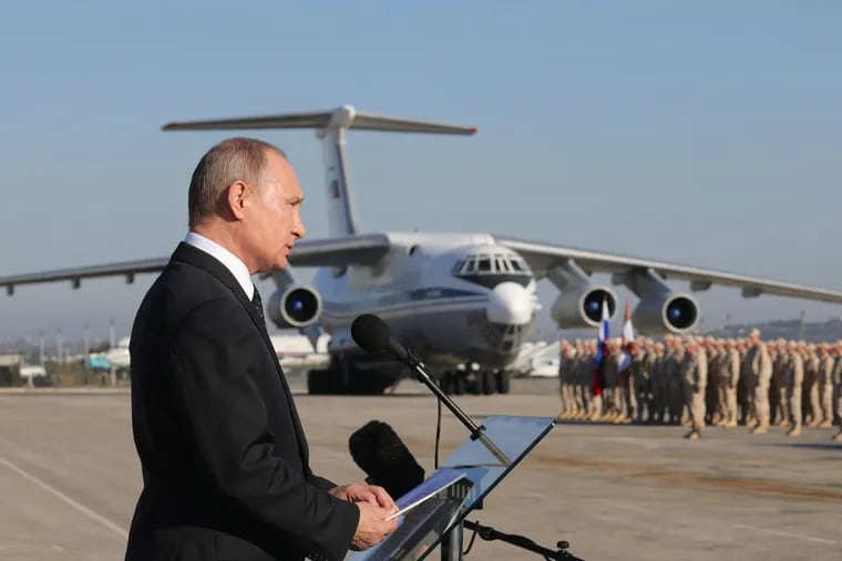 Russian President Vladimir Putin addresses the troops at the Hmeimeem air base in Syria in December 2017.