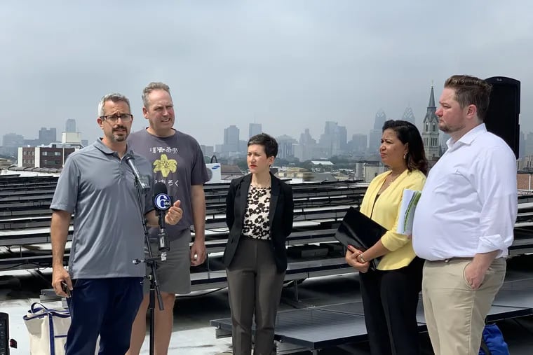 Micah Gold-Markel, left, founder of Solar States, discussed the recent report detailing Pennsylvania's clean energy job growth, on Tuesday, June 18.