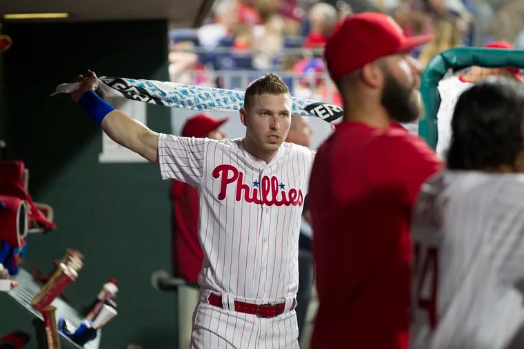 Corey Dickerson, left, of the Phillies stretches in the dugout during the game against the White Sox  at Citizens Bank Park on Aug. 2, 2019.  Dickerson was used as a pinch hitter.