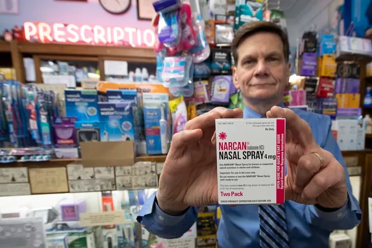 Pharmacist Walter Cwietniewicz, inside his Ellis Pharmacy on Brown Street in Fairmount, shows a Narcan nasal spray pack on Wednesday, November 21, 2018. He says he stocks the drug because it's the right thing to do.