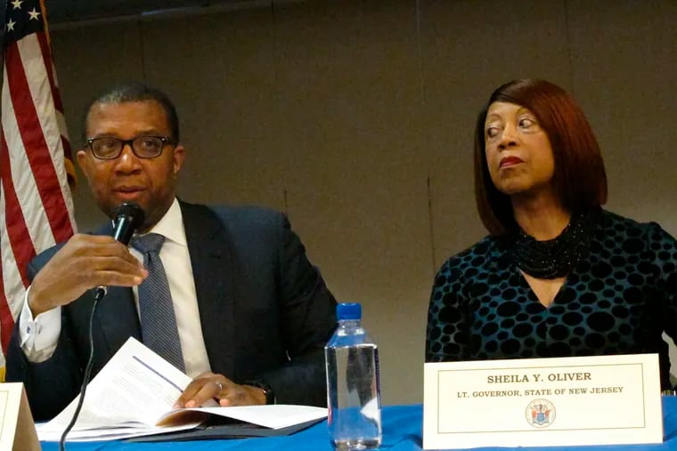 Jim Johnson, special counsel in the New Jersey governor's officer, left, and Democratic New Jersey Lt. Gov. Sheila Oliver, right, speak at an event in Atlantic City at which she said the state's takeover of Atlantic City will remain in place for the full five-year term envisioned by former Republican Gov. Chris Christie when it began in 2016.