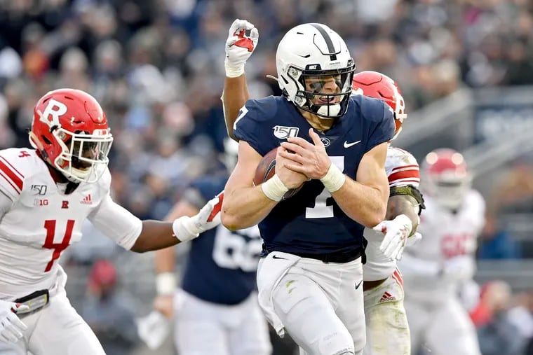 Penn State quarterback Will Levis (7) outruns Rutgers defenders for a first down on Saturday, Nov. 30, 2019, at Beaver Stadium in University Park, Pa. The host Nittany Lions won, 27-6. (Abby Drey/Centre Daily Times/TNS)