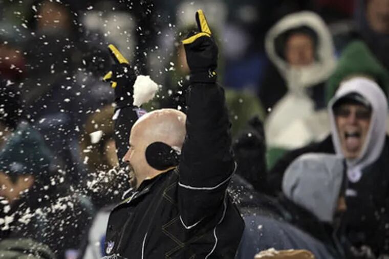 Snowballs hit a football fan during the fourth quarter while the
Eagles played the San Francisco 49ers on Sunday. (Yong Kim / Staff Photographer)