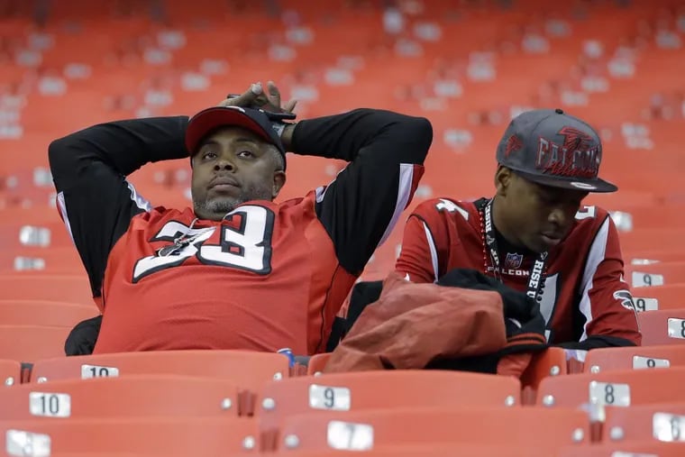 Atlanta fans watch the teams leave the field after a Falcons loss.