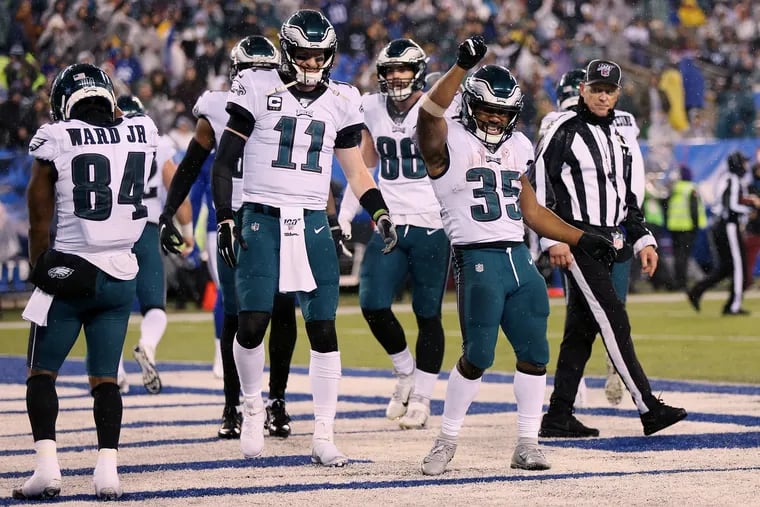Eagles running back Boston Scott (35) celebrates his third-quarter touchdown during a game against the New York Giants at MetLife Stadium in East Rutherford, N.J., on Sunday, Dec. 29, 2019.