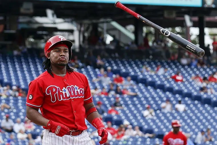 Maikel Franco tosses his bat after striking out to end the eighth inning against the Los Angeles Dodgers.