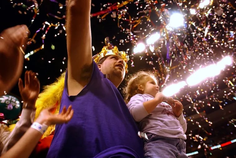 Bill “El Wingador” Simmons in his glory days – after winning the 2002 Wing Bowl, holding daughter Felicia, then 4.
