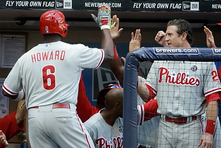 Ryan Howard (6) is congratulated after hitting a two-run home run during the ninth inning of a baseball game against the Milwaukee Brewers Thursday, July 10, 2014, in Milwaukee. (Morry Gash/AP)