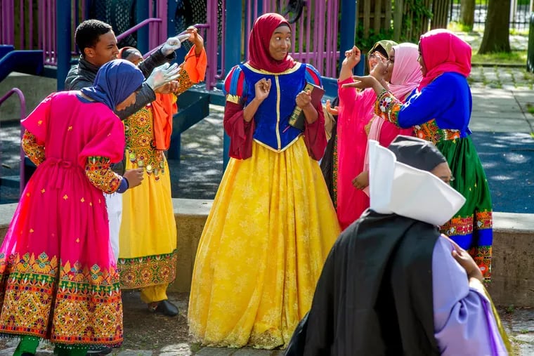 Zhamina Muhammad (center) as Snow White during rehearsals of Islamic Snow White, in the open air Clinton St. Amphitheater in Camden May 10, 2021. The musical will be performed for Eid al-Fitr.