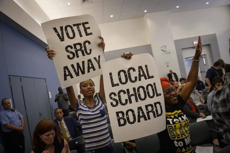 The SRC has proven unpopular during its 16-year history. In this file photo, activists in 2016 called for an end to the commission. The SRC will vote to abolish itself on Thursday.