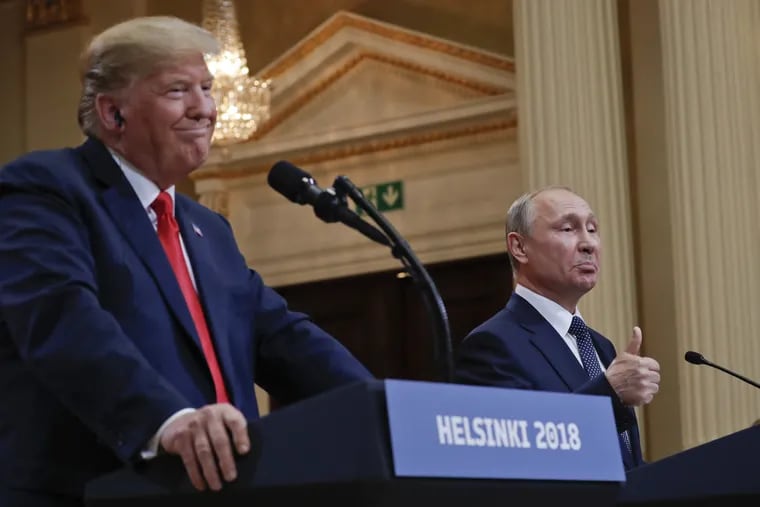 Russian President Vladimir Putin, right, and U.S. President Trump give a joint news conference at the Presidential Palace in Helsinki, Finland, on Monday, July 16, 2018.