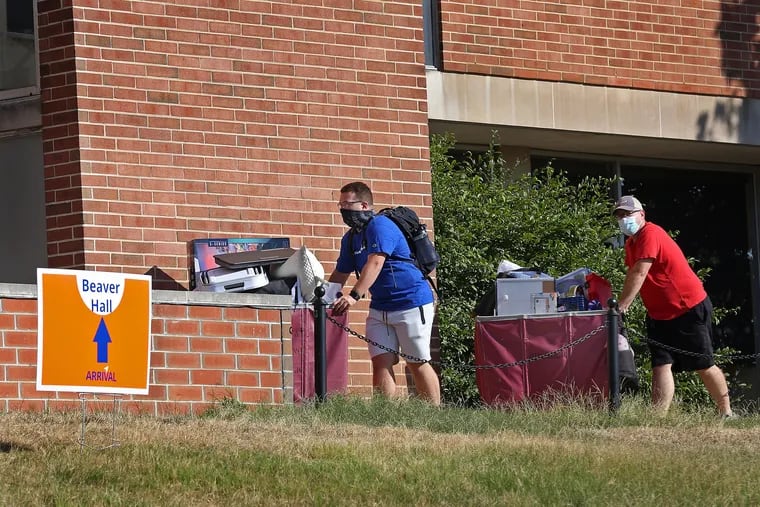 Penn State University freshmen move their belongings to their residence hall on the University Park campus on Aug. 18. Freshmen were assigned time slots for move-in due to COVID-19 restrictions.