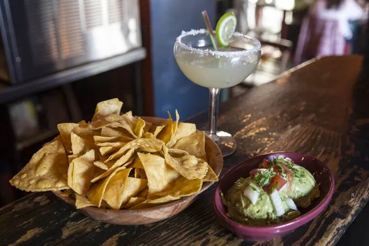 Chips and guacamole with a classic margarita from Cantina Los Caballitos. ( Colin Kerrigan / Philly.com )