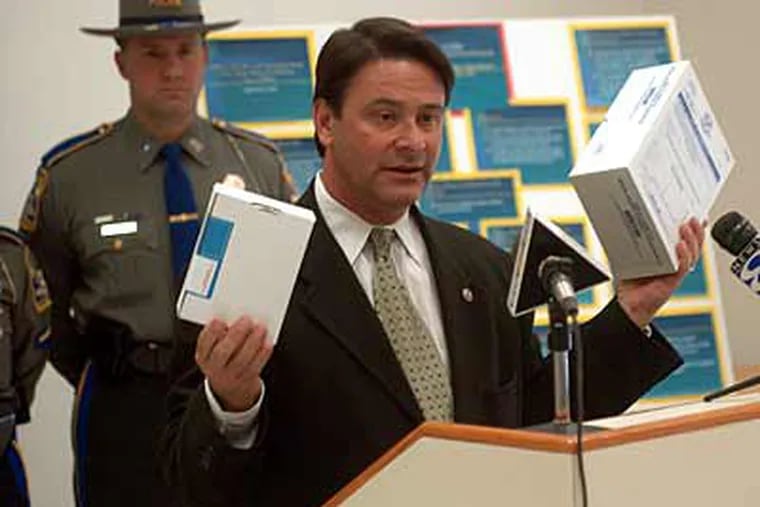 In this file photo, Connecticut Chief State's Attorney Christopher L. Morano announces the issuance of a new rape kit at a news conference in 2004. (AP Photo/Bob Child)