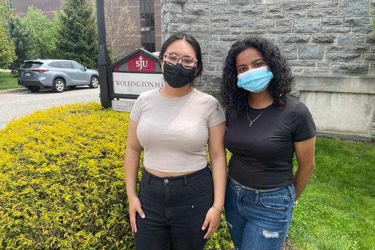 Lesley Reyes, 22, and Shishira Philip, 21, stand outside St. Joseph's University campus ministry. Both women expressed sadness and anger over a Supreme Court draft overturning Roe v. Wade.