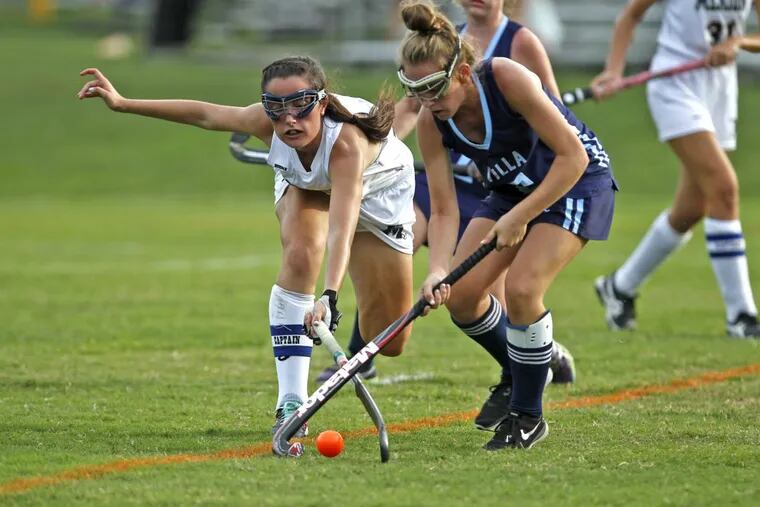 Merion Mercy’s Caitlin Farkas (left) and Villa Maria’s Meghan Dillon fight for ball control in a recent game.