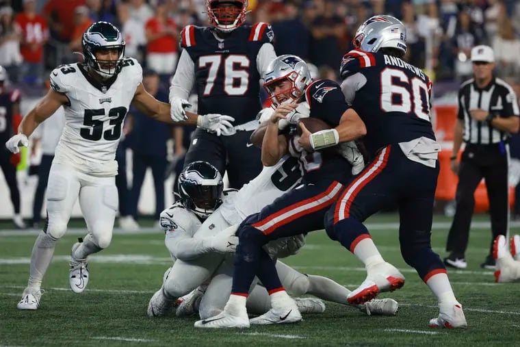 Eagles defensive tackle Jalen Carter sacks New England Patriots quarterback Mac Jones with less than a minute left in the fourth quarter at Gillette Stadium.