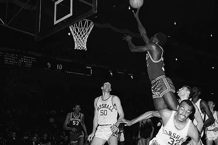 Basketball College Games NIT Tournament  1967.  Villanova’s Johnny Jones goes up high to score a basket against Marshall College in first half of opening round game in the National Invitation Tournament at New York’s Madison Square Garden on March 9, 1967. Marshall Players are Bob Allen (50) and Bob Redd (32).