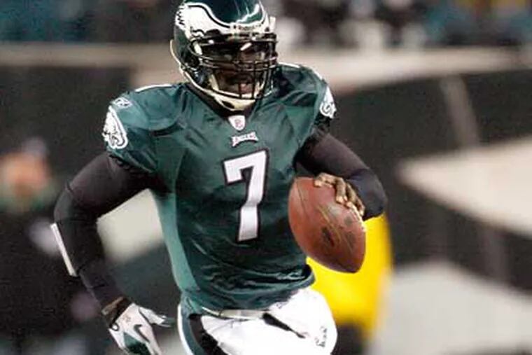 Michael Vick notched 350 combined yards and 3 TDs in Thursday night's win. (David Maialetti / Staff Photographer)