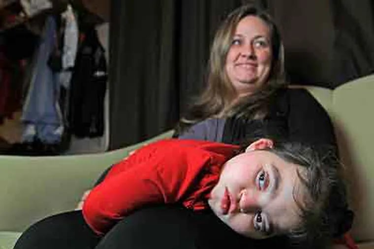 Amelia Rivera, 3, with her mother, Chrissy, at home in Stratford, N.J. (Michael Bryant / Staff Photographer)