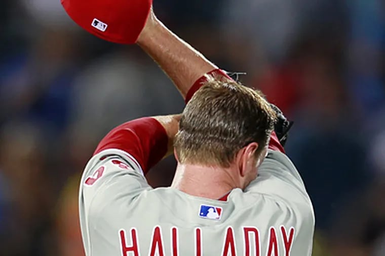 Roy Halladay has been placed on the disabled list. (John Bazemore/AP)