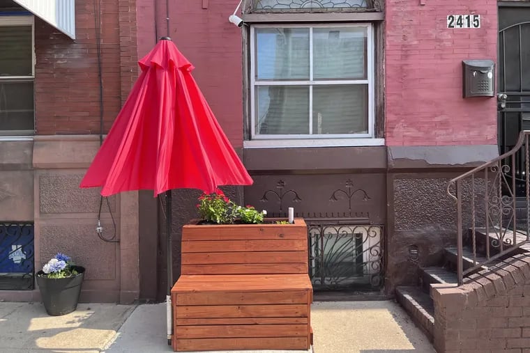 A combination sidewalk cooling station in Grays Ferry on Tuesday. It is one of 120 such structures to be installed under a program directed by Drexel University professor Franco Montalto.