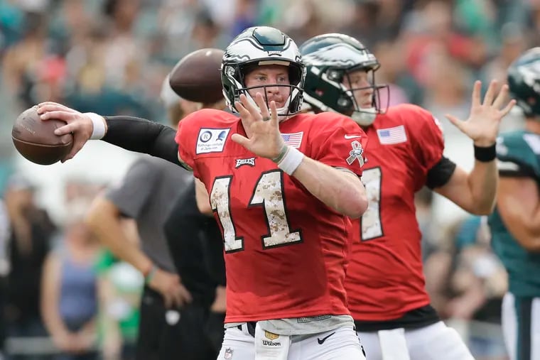 By the time camp rolls around, there will be new faces surrounding Carson Wentz (left) and Nate Sudfeld in the quarterbacks room.