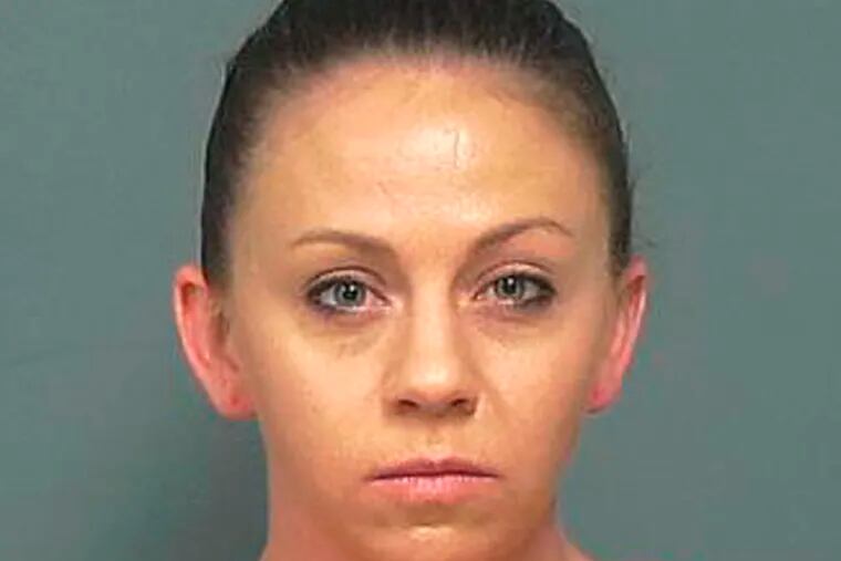 This undated photo provided by the Mesquite Police Department shows Amber Guyger. Former Dallas police officer Guyger was indicted on murder charges Friday, Nov. 30, 2018, nearly three months after she fatally shot an unarmed black neighbor whose apartment she said she entered by mistake, believing it to be her own. (Mesquite Police Department via AP)