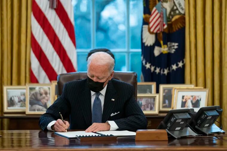 President Joe Biden signs an executive order Monday reversing the Trump-era ban on transgender individuals serving in the military.