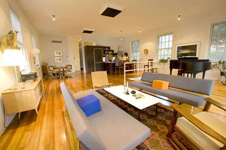 The Swarthmore home of Shari and Jan Almquist who took the old Bell telephone switching station and turned it into an interesting modern space. In this photo, the expansive living space which includes a living room, dining area and kitchen.(Ed Hille/ Staff Photographer)