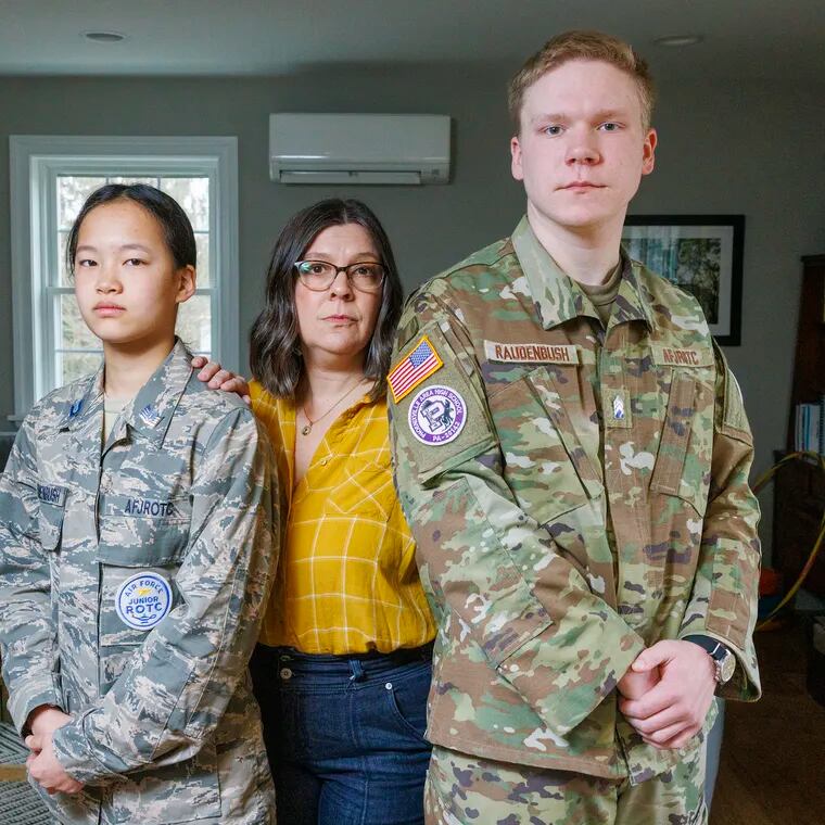 From left are Lydia Raudenbush, mother Kelly and brother Drew at their Phoenixville home on Thursday. Both Lydia and Drew Raudenbush are in the Phoenixville Area School District's Air Force JROTC program, which the Air Force plans to close at the end of the school year due to inadequate enrollment.