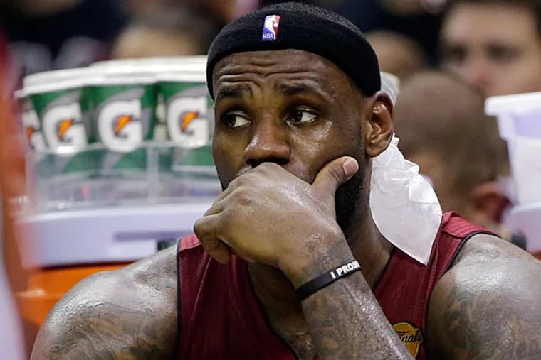Heat forward LeBron James watches action against the San Antonio Spurs during the second half in Game 1 of the NBA basketball finals on Thursday, June 5, 2014 in San Antonio. (Eric Gay/AP)