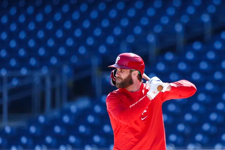 Phillies slugger Bryce Harper gets in some batting practice during spring training at BayCare Ballpark in Clearwater, Fla. The Phillies first game is Saturday against the Toronto Blue Jays.