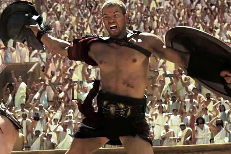 Kellan Lutz is Herc, banished, taken captive, and fighting as a gladiator to get back to Greece before his beloved marries another.