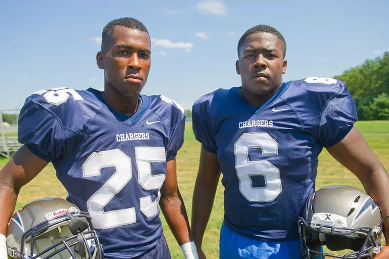 Timber Creek football linebackers Tavian Martin (left) and Julian Mahan pose during practice at the high school in the Erial section of Gloucester Township, NJ.